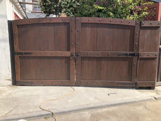 Custom spanish style double swing gate with IPE wood designed for our client