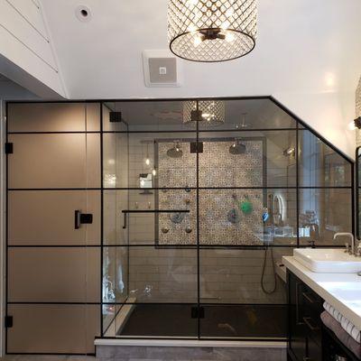 3/8" Starphire Satin Etched gridded glass system on shower using matte black hardware.