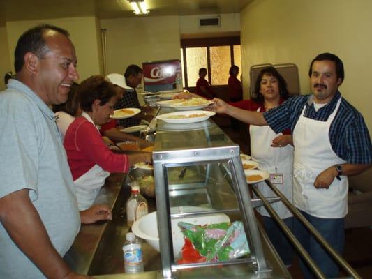 Volunteers cooking for Marriage retreats.