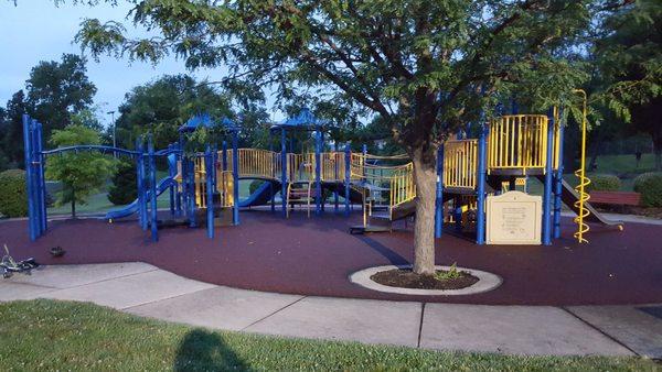 Playground with climbing, slides, and money bars