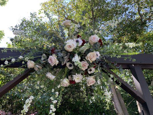 Beautiful flowers to accent the wedding arch