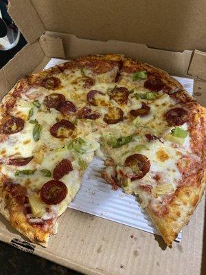 Large pizza with pineapple, green peppers and pepperoni