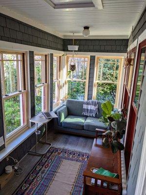 Porch/sunroom with FoldUp windows installed.