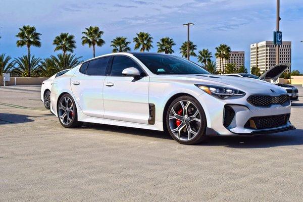 My Kia stinger exterior wrapped in 3M gloss flip ghost pearl