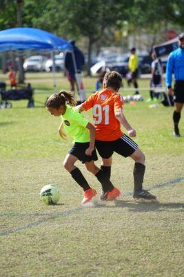 A scramble for possession as players give their all on the field.