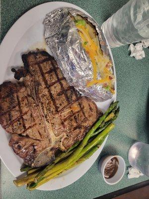 Steak cooked to requested, baked potato fully cooked and loaded, asparagus grilled and forgot to take a photo of the fry bread.