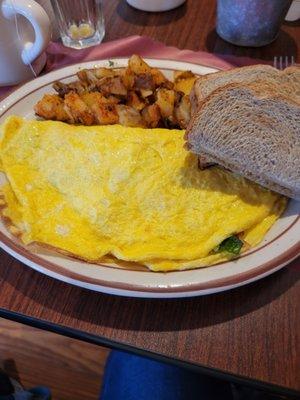 Omlet with bacon, spinach and cheese.