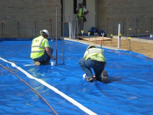 Our high performance under-slab vapor barriers being installed under the concrete for ultimate moisture protection (Viper 2) www.viper2.com