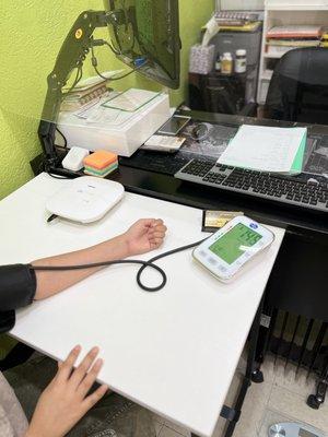 Blood pressure test of a client during a Consultation