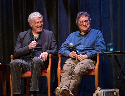 Author Randall Sullivan and Marty Lagina smile during an event about Sullivan's book, "The Curse of Oak Island."