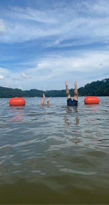 Hand stands for happiness at the lake!