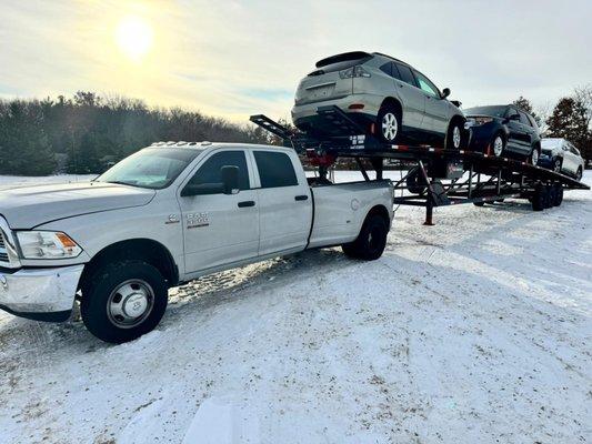 Need to transport multiple vehicles across states? Premier Towing has you covered! Contact us now for our reliable three-car hauler