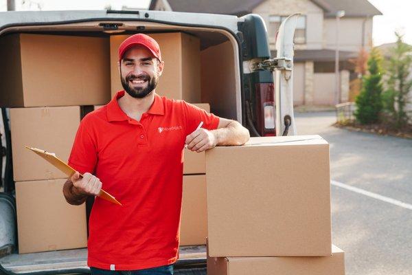 Employee completing moving inventory checklist.