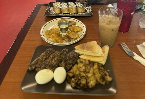 Steak and eggs, tostones, iced cafe con leche, and French toast