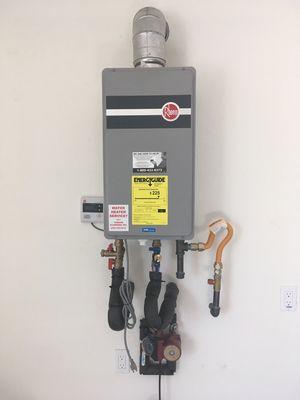 Rheem tankless water heater with Recirculating pump.