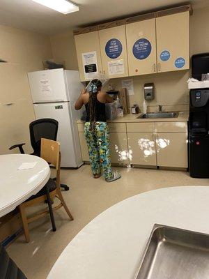 Employee in break room wearing pajamas