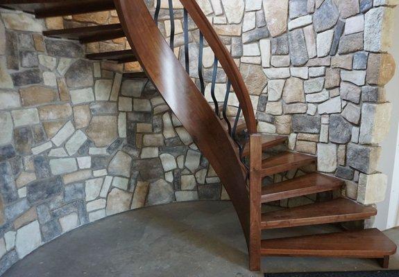 Custom curved staircase with solid, floating treads