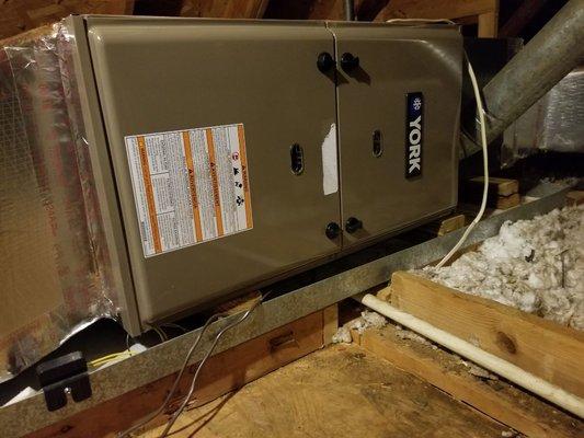 80% furnace installation in a attic.