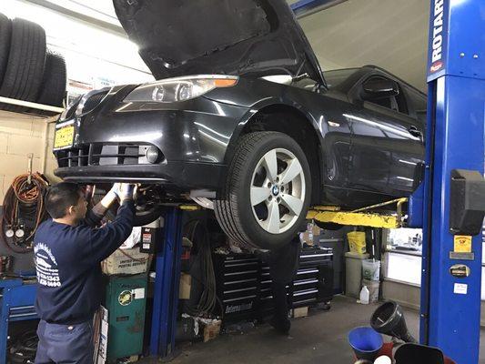 David working on customer's BMW