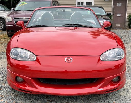 Red convertible Miata