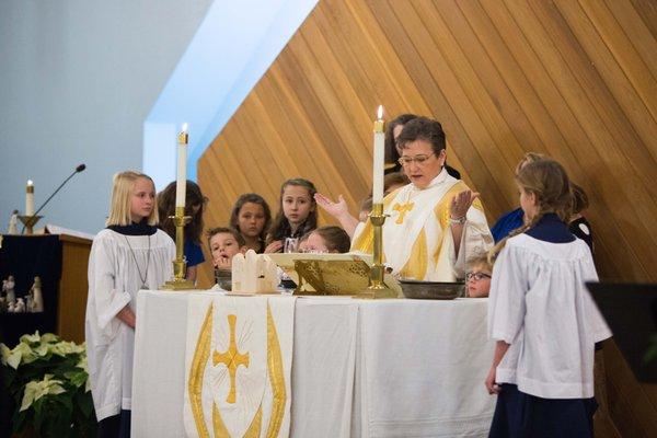 Blessing of Communion by all, young and old.