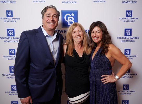 Agent of the year photo with owners Jamie and Robin Mancuso