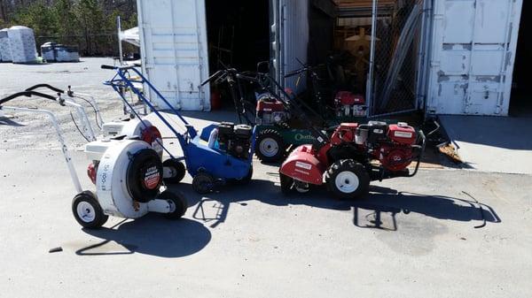 Waiting as they unpack the clown car of equipment to find a working rototiller