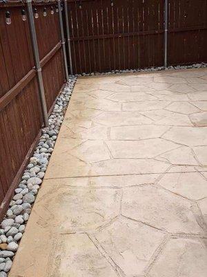 Stamped concrete with pebbles around