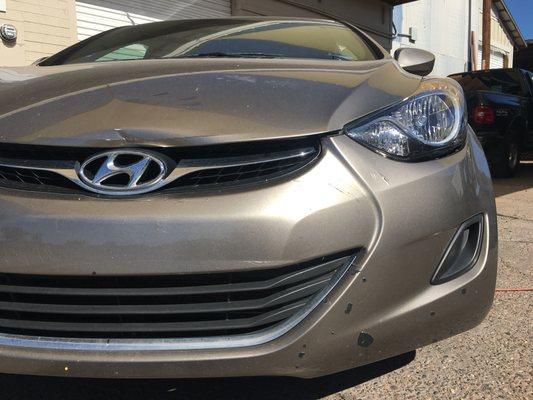 Bent hood and damaged front bumper on this 2013 Hyundai