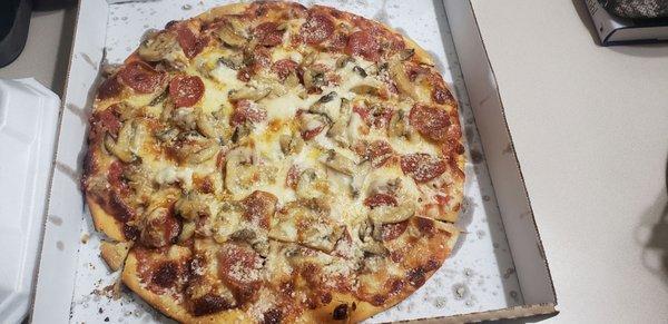 Thin crust Sausage, pepperoni, mushroom with light sauce.  Awesome!