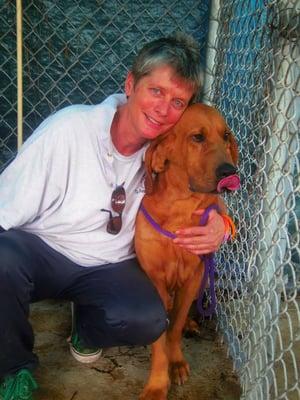 Miss Sue, the dog lady, with CASPER,  saved from a sad and neglectful situation on a farm in the deep south where he was tethered to a tree.