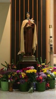 Devotion to Saint Thérèse of Lisieux, the patroness of our church, on her feast day.