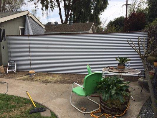 Custom corrugated metal fence.