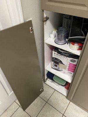 Cabinet door had gotten broken off.