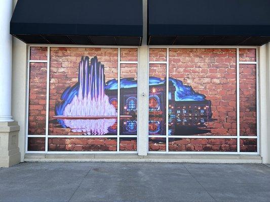 Large format vinyl window display spread over 16 windows