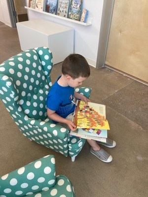 Reading books in the little library chairs