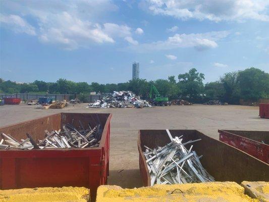 Wide shot of the yard and aluminum bins