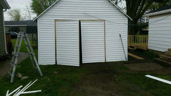 Old garage with new siding and new roof.