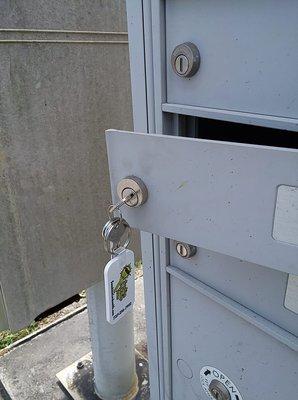 A mailbox lock replaced with a new lock and new keys.