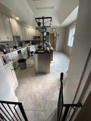 Tile floor installation in kitchen