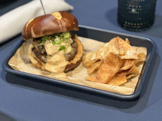 Bison burger with carmelized onion and beer cheese served with house made chips.