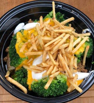 Puerto Rican Baked Potato: Topped with seasoned  ground beef, cheese, broccoli, sour cream, & crispy fries