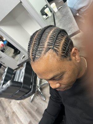 Men stitch braids