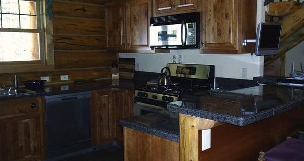 Big Sky Montana.  Kitchen countertop, Granite tile with bullnose edges honed and polished on site.  Installation by Cutthroat Tile and Stone