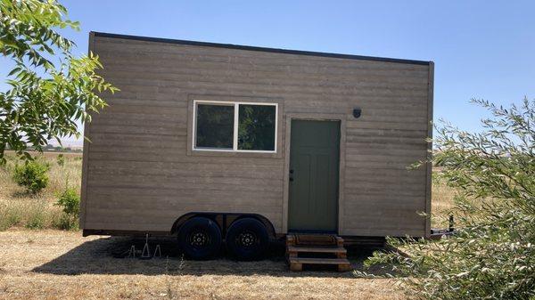 Our finished tiny house on the farm where it will house local farm workers.