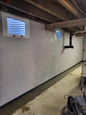 Painted Walls with Basement Waterproofing System Installation