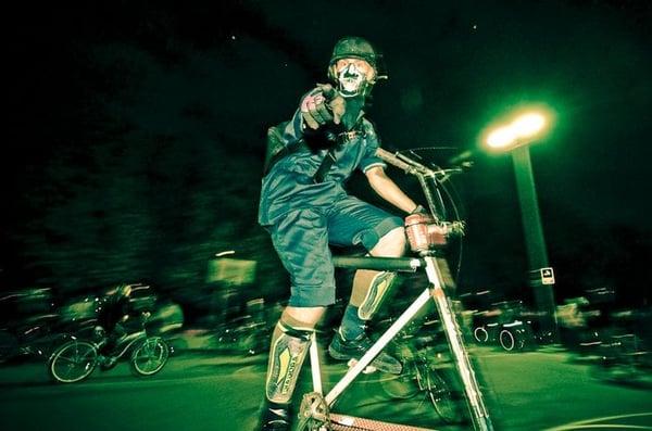 A Midnight Rida rides a tall bike on a recent ride.