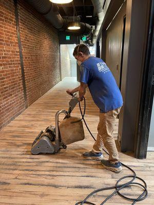 Sanding a wood floor in Benton Ky.