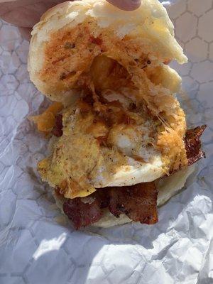 Inside of the loaded bacon egg and cheese biscuit