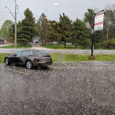 The Parkside Restaurant sign and an unlucky car in today's hail storm!